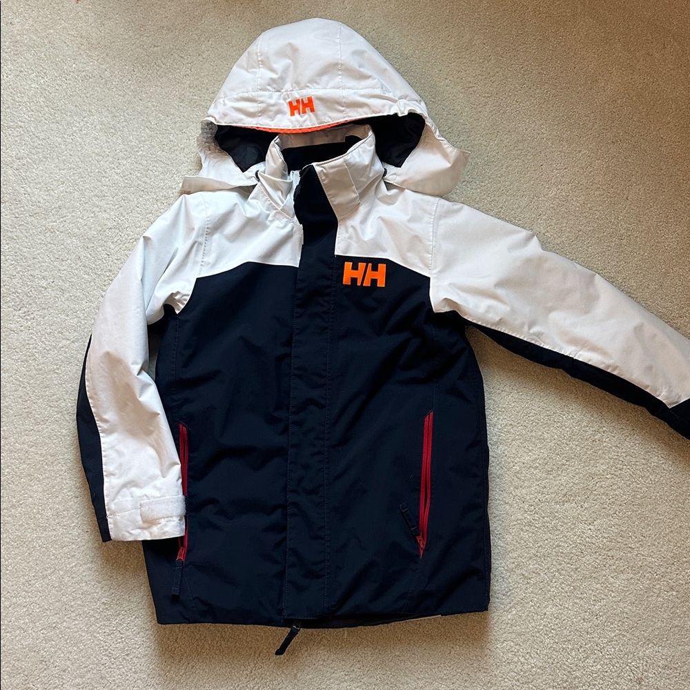 Helly Hansen junior ski jacket navy blue with white orange and red details. Sz10